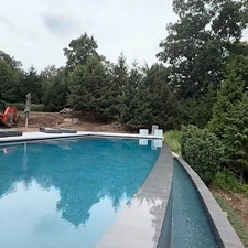 Oasis-Pool-Construction-Builds-a-Luxurious-Pool-with-an-Infinity-Pool-Feature-in-Franklin-Lakes-NJ 0